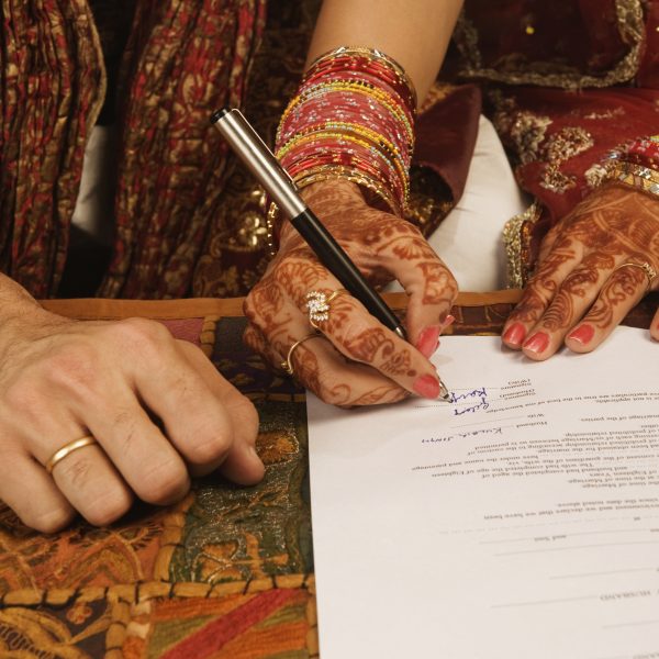 How can two people belonging to different religions get married in India?